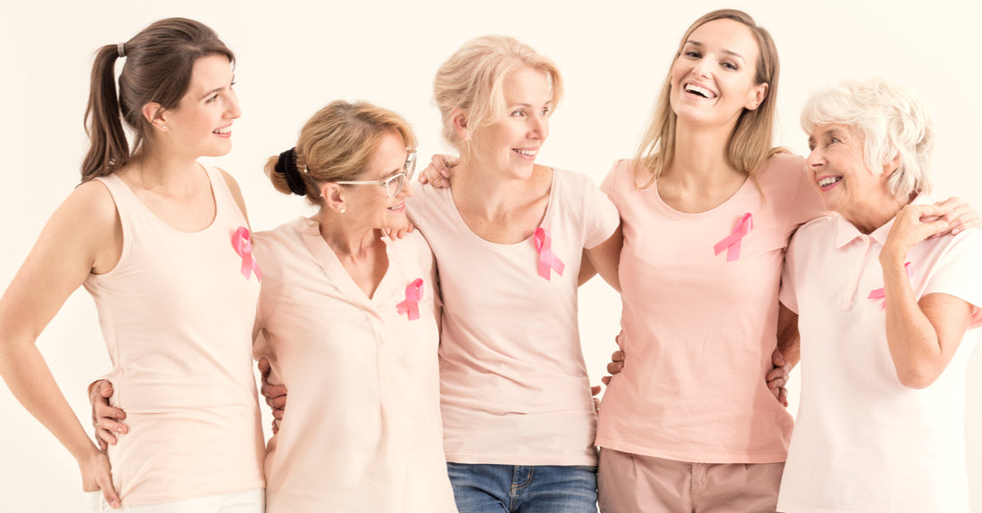 Group of positive women celebrating breast cancer awareness month.